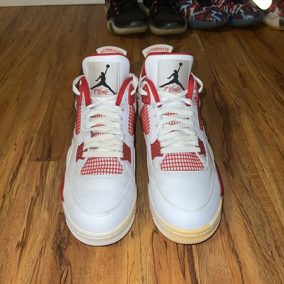 Air Jordan 4 White and Red Sneakers - Picture 2 of 5